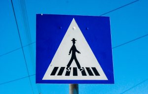 Man in crosswalk sign